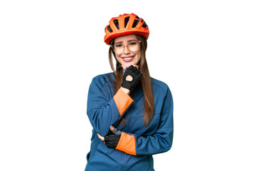 Young cyclist woman over isolated chroma key background with glasses and smiling
