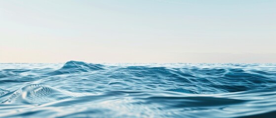 Fototapeta premium The ocean is calm and peaceful, with a few waves breaking on the shore