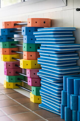 Colorful swim floats and kickboards in Indoor pool