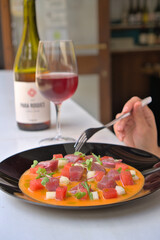 Elegant Tuna Tartar Served with Wine at a Restaurant