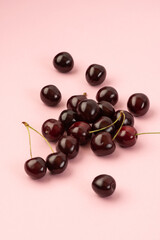 Sweet cherries on a pink background