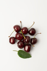 Cherry with leaves on a white background