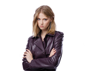 High fashion photo of a beautiful elegant young woman in pretty long purple lilac leather jacket, coat posing on white background. Slim figure. Blonde
