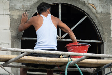 A man is working on a building