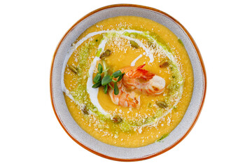 Pumpkin cream soup with shrimp. On a white background, isolated.