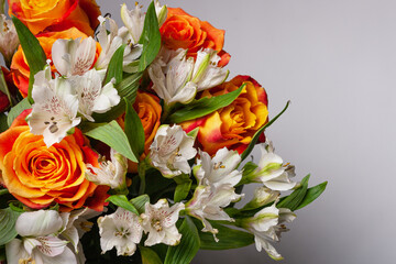 white and orange flowers on a gray background, a copy of the space