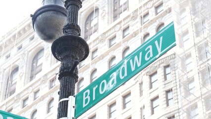 Broadway street road sign, Manhattan midtown district architecture, New York City corner. Traffic signage. Flatiron Building near Madison Square Park. Crossroad of 23 street, Bway and 5 Fifth avenue.