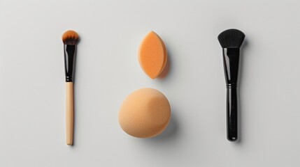 Makeup Brushes and Sponges on White Background