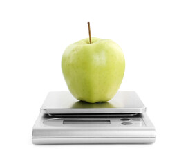 Kitchen scale with apple isolated on white