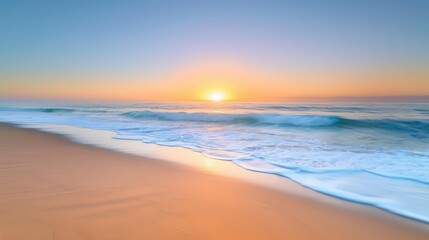 Serene beach sunrise scene with gentle waves and a pastel sky. The image captures the peacefulness of dawn by the ocean.