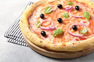 Delicious vegetarian pizza on light grey table, closeup