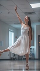 Fototapeta premium oung female dancer of classic ballet practising in the dance studio