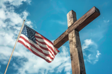 A wooden cross is in front of a flag with the word USA on it