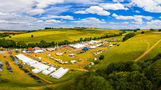 Aerial panoramic shot of the Chalke Valley History Fair under summer sky.