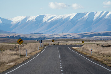 New Zealand Otago road landscape with snow capped mountains  near Queenstown and Wanaka