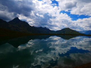 View on a lake and mountains above Defereggental valley on a summer day