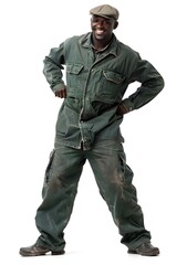 Studio portrait of a smiling African man wearing a green jumpsuit