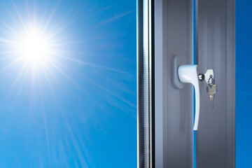 A fragment of a new plastic door with a handle in a private house