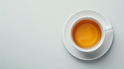 Minimalist top view of a white cup filled with soothing herbal tea against a clean background, perfect for a calming atmosphere.