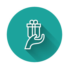 White line Give gift icon isolated with long shadow background. Gift in hand. The concept of giving and receiving a gift. Green circle button. Vector