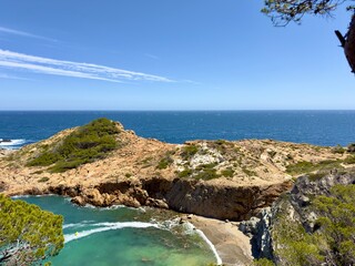 Cala s'Eixugador, view from a rock overlooking the Mediterranean Sea and the rocky outcrop of the bay of Sa Tuna, Costa Brava, Girona, Catalonia, Spain