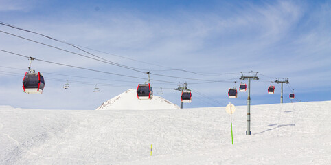 Gudauri Ski Resort: Gondola (Ski Lift) and Snow-covered Caucasus Mountains in Distance - Gudauri, Georgia