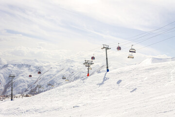 The peaks of snowy Caucasus mountains in The Gudauri Ski Resort, Georgia. Snowboarding in The Gudauri Ski Resort, Georgia
