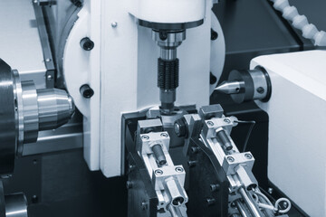 Modern metalworking cnc machine for cutting, drilling, milling metal details.