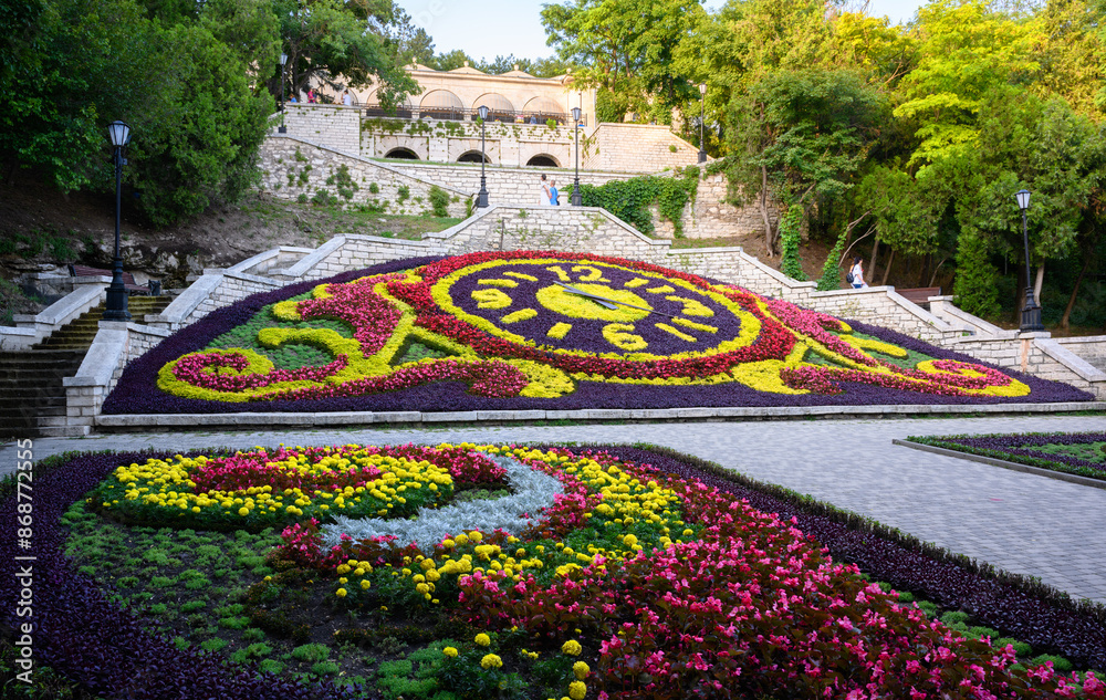 Wall mural landscape design with flowers in pyatigorsk, russia. beautiful floral clock in pyatigorsk city in su