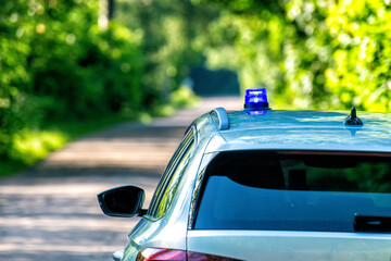 blue flashing light on a police car