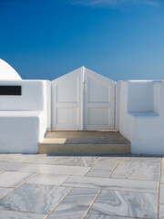 Traditional courtyard entrance in the village of Oia, Santorini, Greece. Traditional architecture. Photo as wallpaper.
