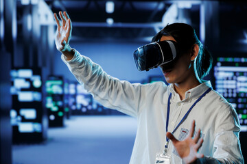 Certified developer in data center uses virtual reality to prevent system overload. Expert with VR...