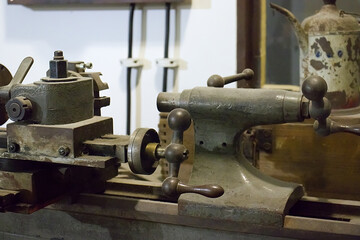 Old iron lathe. Workshop equipment, metal and woodworking machine. Lathe. Iron. Handmade craft production.