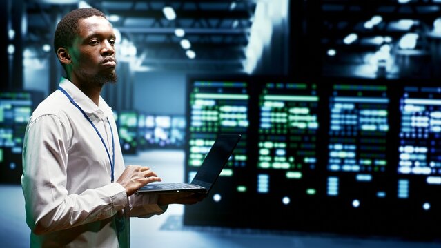 Engineer walking through cryptocurrency mining facility server rows solving complex mathematical equations. Expert in data center housing blockchain technology high volume real time transactions