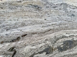 A polished granite marble kitchen surface exudes elegance and sophistication, with its smooth, glossy finish and durable, high-end material enhancing any modern interior design.