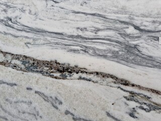 Fototapeta premium A polished granite marble kitchen surface exudes elegance and sophistication, featuring a sleek, durable finish that enhances the interior design with timeless beauty and luxurious appeal.