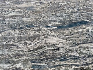 A polished granite marble kitchen surface exudes elegance and luxury, featuring a sleek, durable finish that enhances the interior design with its timeless beauty and sophisticated appeal