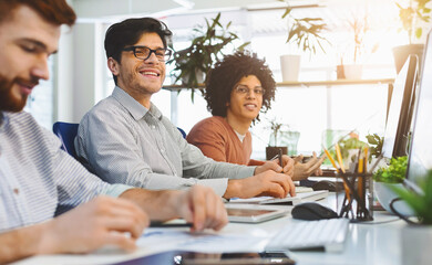 Young male team working at IT developing company, sitting at coworking office, free space