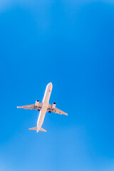 Airplane before landing in blue sky, Airbus A321-200