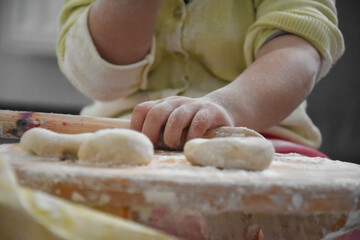 Female hands knead the dough for bread