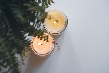 Creating a warm and cozy atmosphere with candles and fern leaves to enhance the interior decor