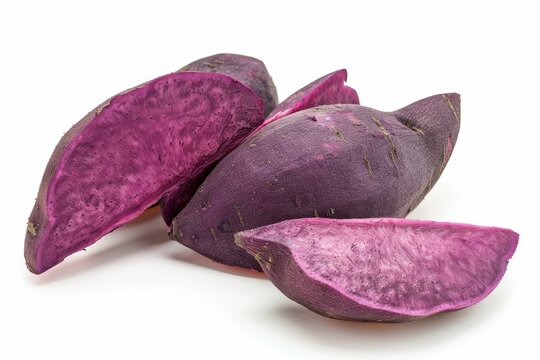 Whole purple sweet potato isolated on white
