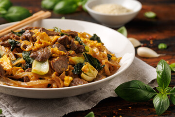 Thai Pad See Ew with beef, eggs, vegetables and rice noodles.