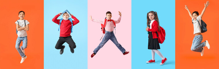Group of happy little school children on color background