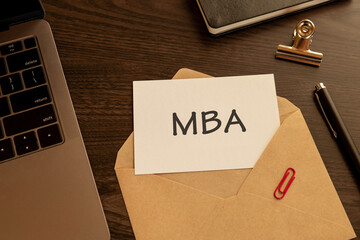 There is word card with the word MBA. It is an abbreviation for Master of Business Administration...