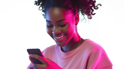 A woman looks happy while checking her mobile device