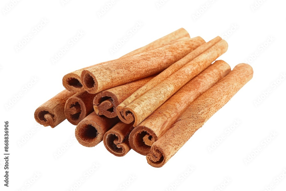 Poster a close-up photo of a pile of cinnamon sticks on a white surface, great for use in recipes or as a d