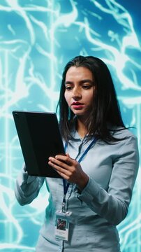 Vertical video Developer using tablet to implement artificial intelligence parallel processing, breaking up complex computational tasks enabling AI systems to process more input data faster, camera A