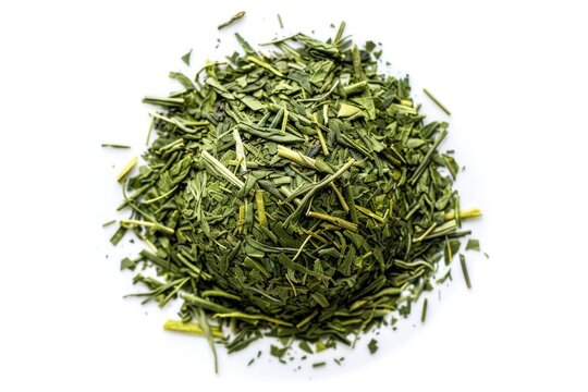 A pile of green tea leaves on a white surface