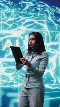 Vertical video Developer using tablet to implement artificial intelligence parallel processing, breaking up complex computational tasks enabling AI systems to process more input data faster, camera B